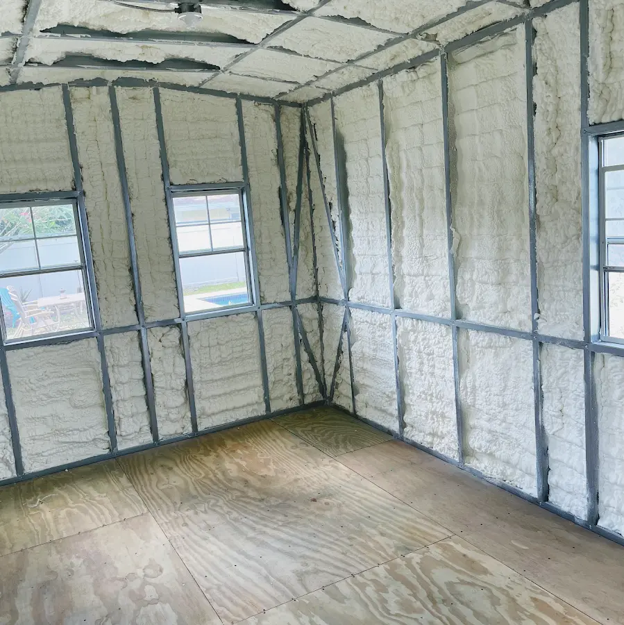 Closed-cell spray foam insulation applied to wall cavities in a residential project in Pinson